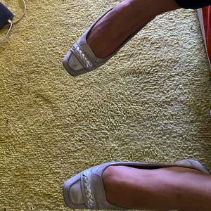 Tod’s silver slippers.  Get your New Years on.